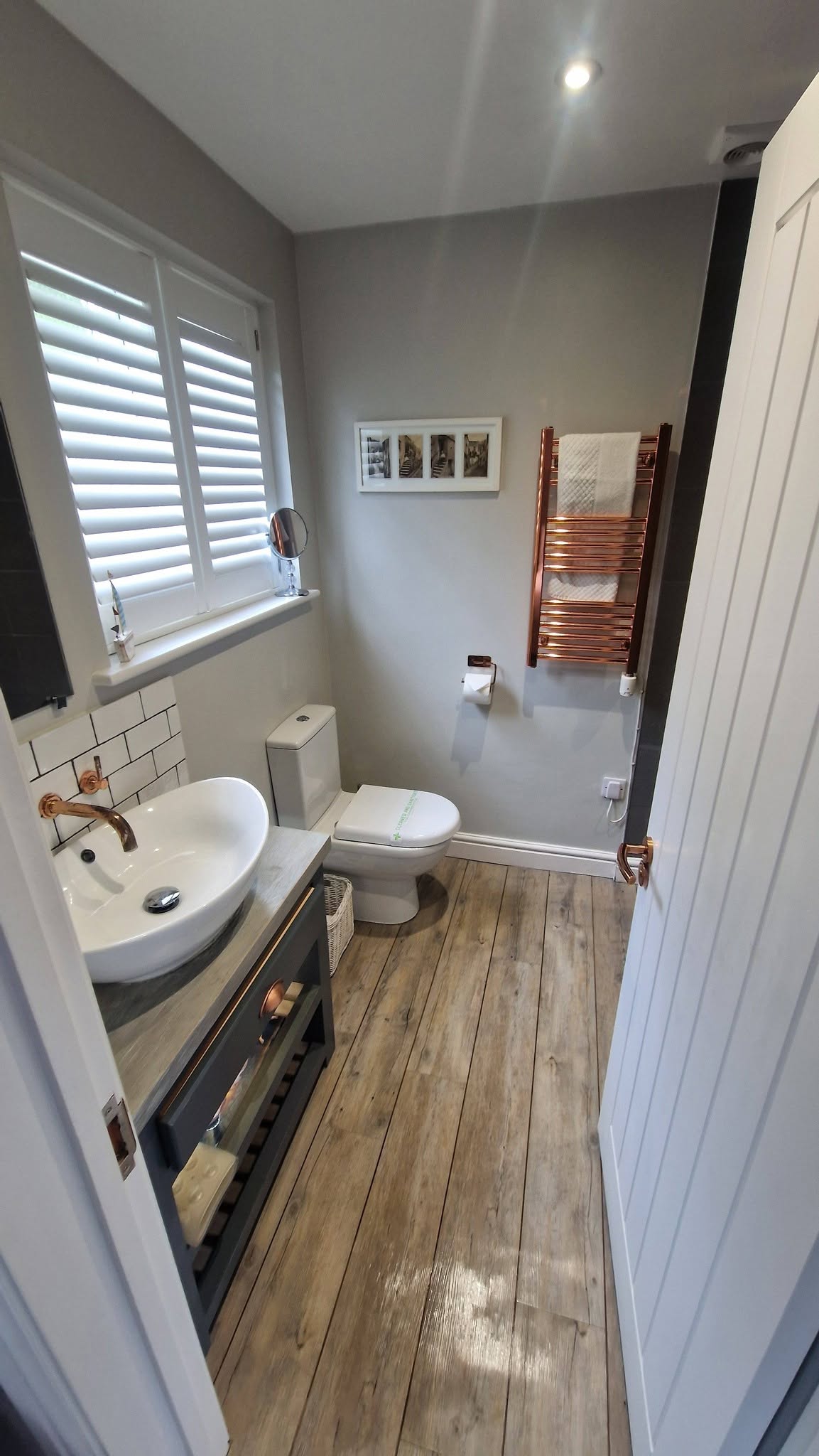 Immaculate bathroom with copper fixtures after a deep clean